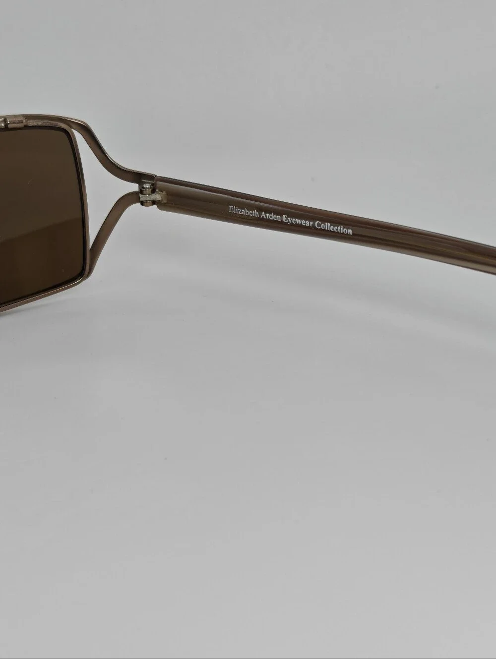 Elizabeth Arden EA5037.  Brown Rectangular Sunglasses with Tinted Brown Lenses.